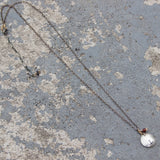 Stamped Metals Collection: Oxidized sterling silver small stamped disc with 14K goldfill and garnet