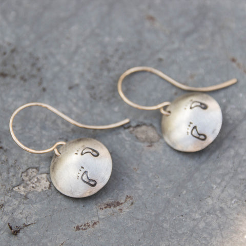 Stamped Metals Collection: Oxidized sterling silver small stamped footprints disc earrings