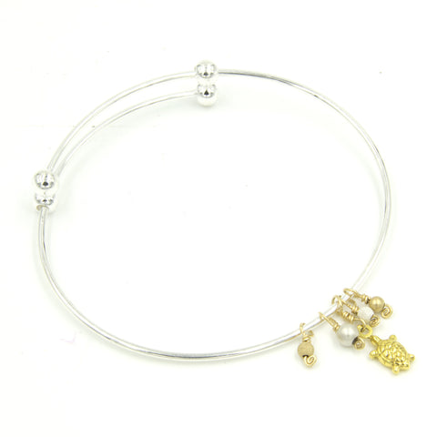 Mixed metal expandable bangle bracelet